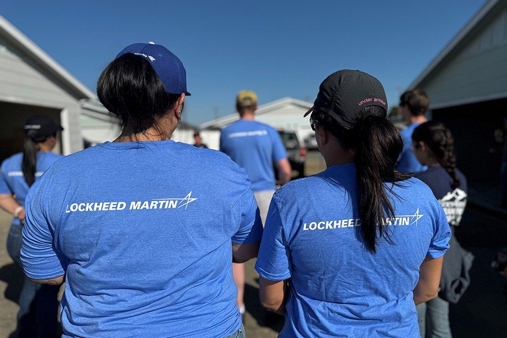 Volunteers in Lockheed Martin shirts