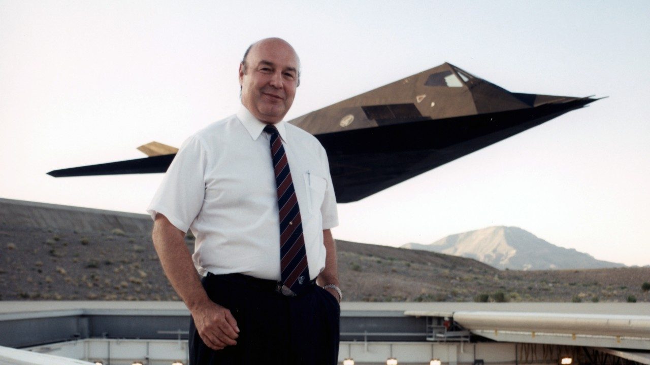 Denys standing in front of an F-117