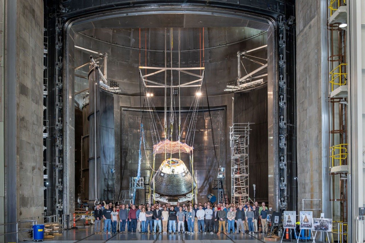 Lockheed Martin team in front of the Orion spacecraft during testing