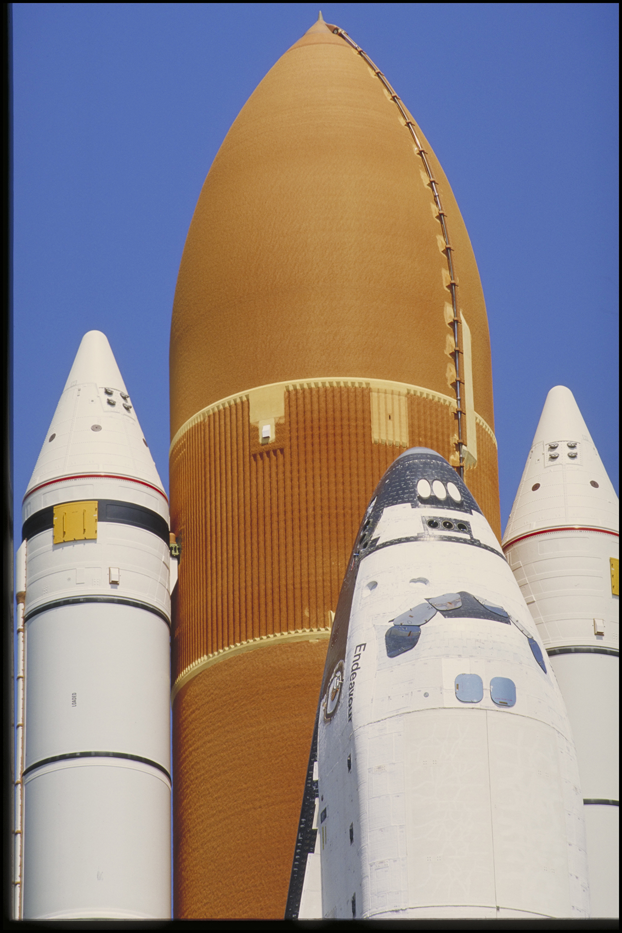The structural backbone of every shuttle takeoff, the tanks were the largest component of each shuttle at 154 feet in length—longer than the Statue of Liberty—and were composed of nearly a half-million parts. The external tank that launched Columbia’s first mission in 1981 weighed nearly 76,000 pounds, but by 1998 Lockheed Martin had developed the Super Lightweight Tank, lowering the weight of the external tank to approximately 58,500 pounds. This change in design and the shift to a lighter aluminum-lithium alloy made it possible for shuttles to carry greater payloads, a breakthrough that allowed the shuttle to deliver to orbit the construction modules that became the International Space Station.