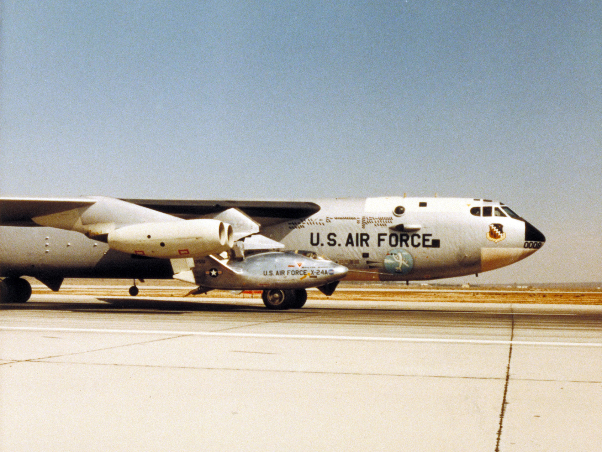 The rocket-powered X-24A lifting body research vehicle with B-52 mother ship.