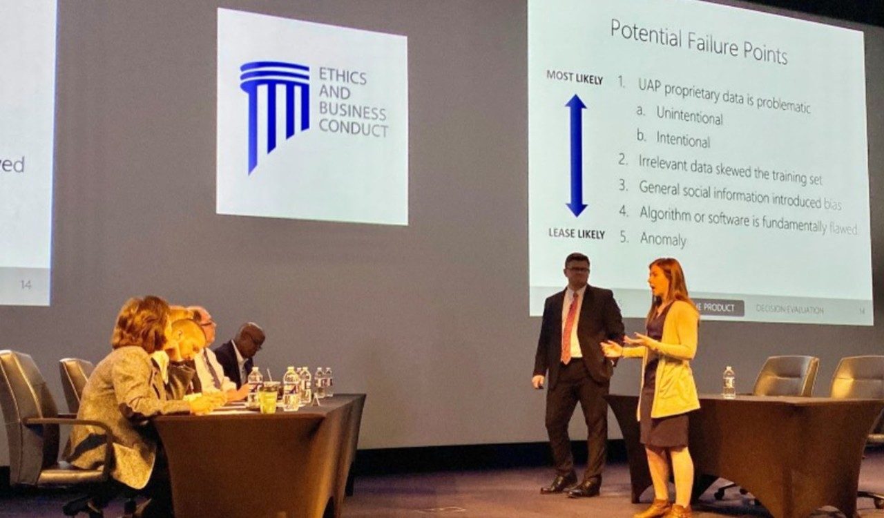 BYU winning team members from the 2020 case competition present their ethical solution to a panel of Lockheed Martin judges. Image taken pre-COVID.