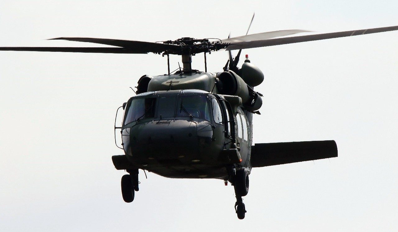 A UH-60P hovers above the ground. Photo: S.J. Lee.