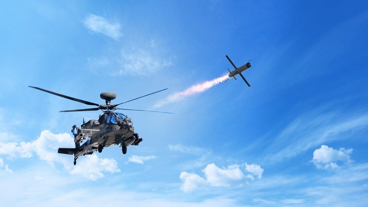 In this composite image, Spike NLOS launches from an AH-64E Apache helicopter.