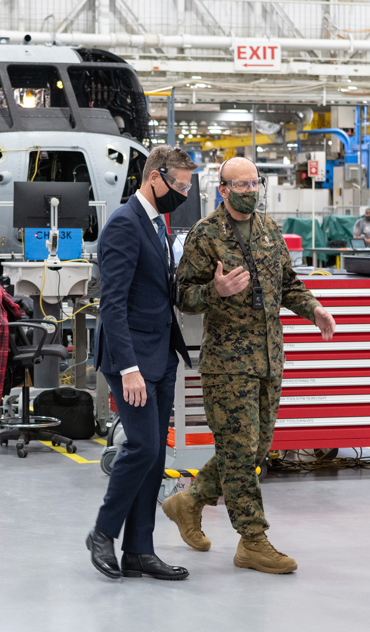 Jim Taiclet and General David Berger walk the manufacturing floor where Sikorsky is utilizing Digital Transformation to build 200 King Stallions for the Marine Corps.