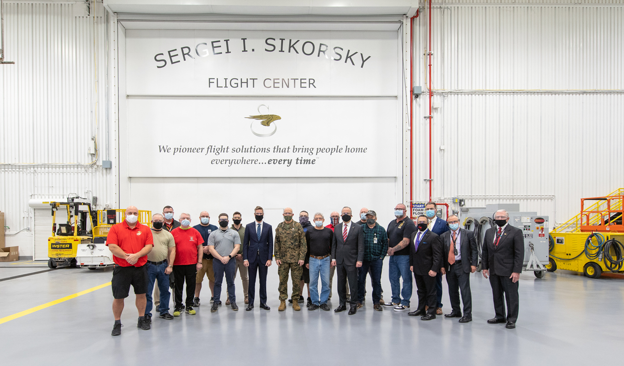 Jim Taiclet and General David Berger pictured with executives and Sikorsky Marine veteran employees.