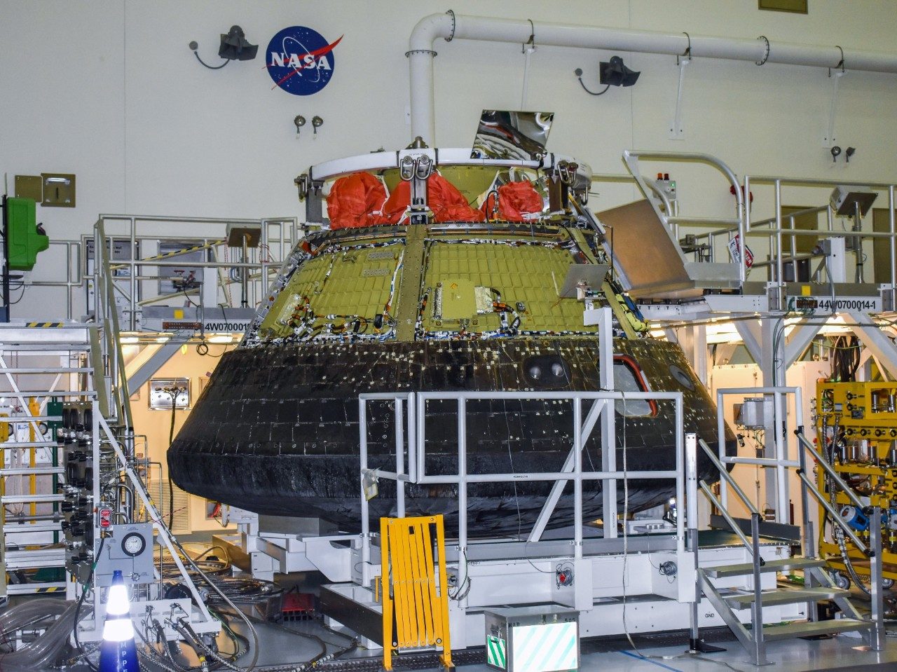Orion undergoing disassembly during post mission checkout at Kenendy Space Center