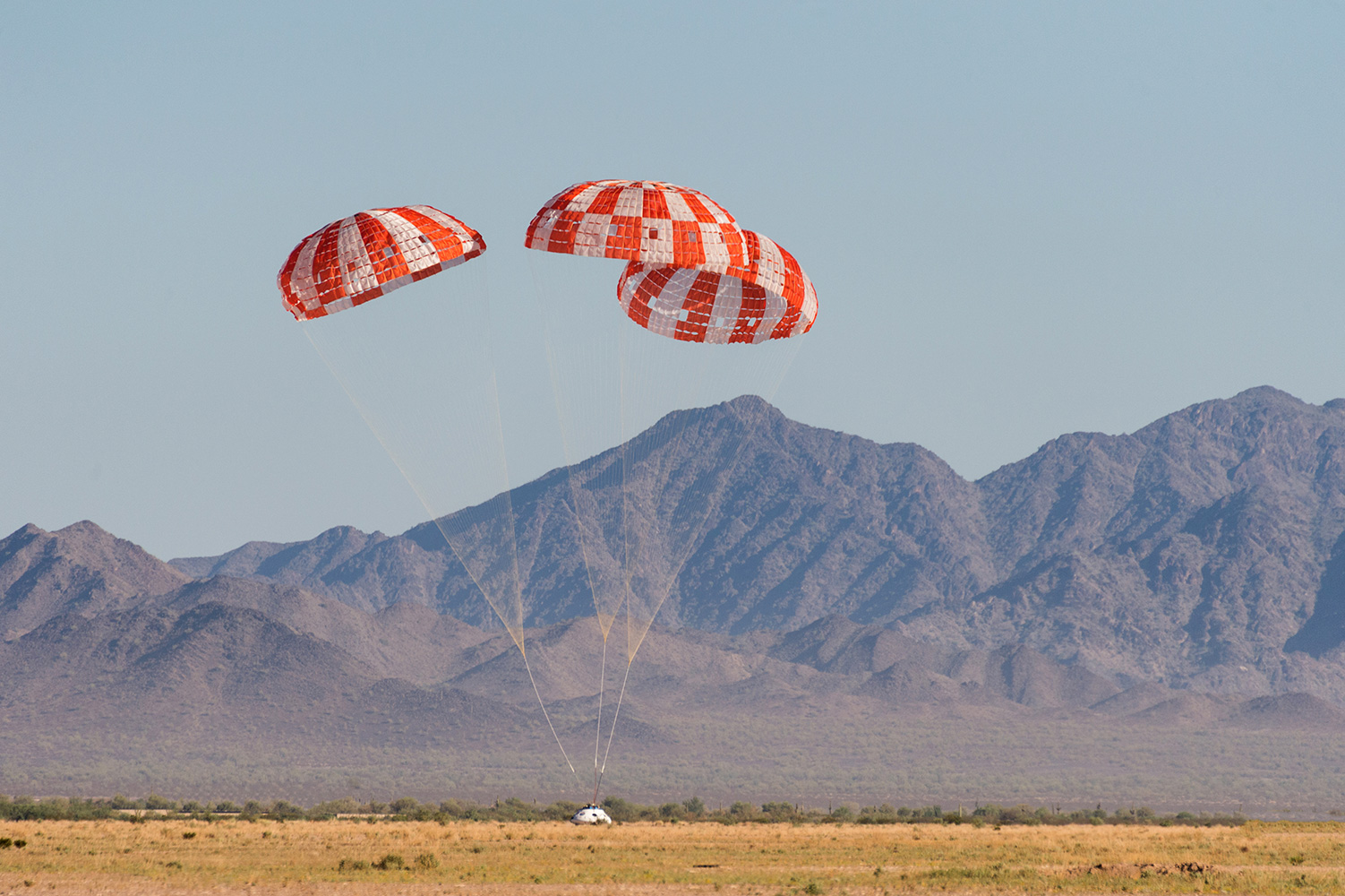 NASA's Orion landing in the desert after its final parachute test.
