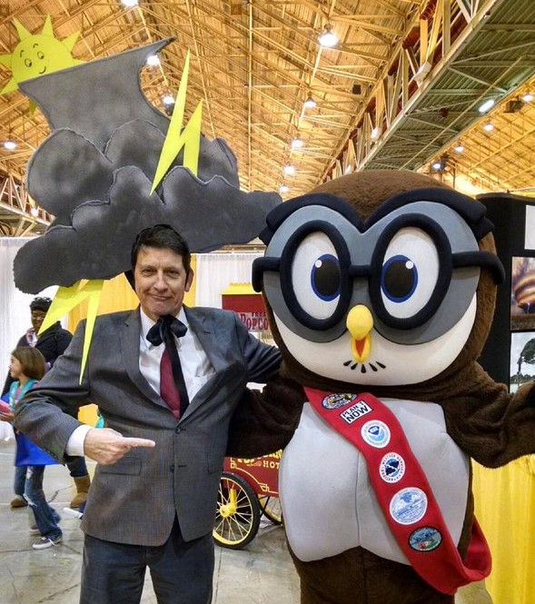 Photo: Jamie strikes a pose with Owlie Skywarn, the mascot of the National Weather Service, during a K-12 STEM outreach event called WeatherFest.
